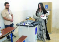 an iraqi kurdish voter casts her ballot at a polling station in akre in iraqi s northern autonomous kurdish region photo afp