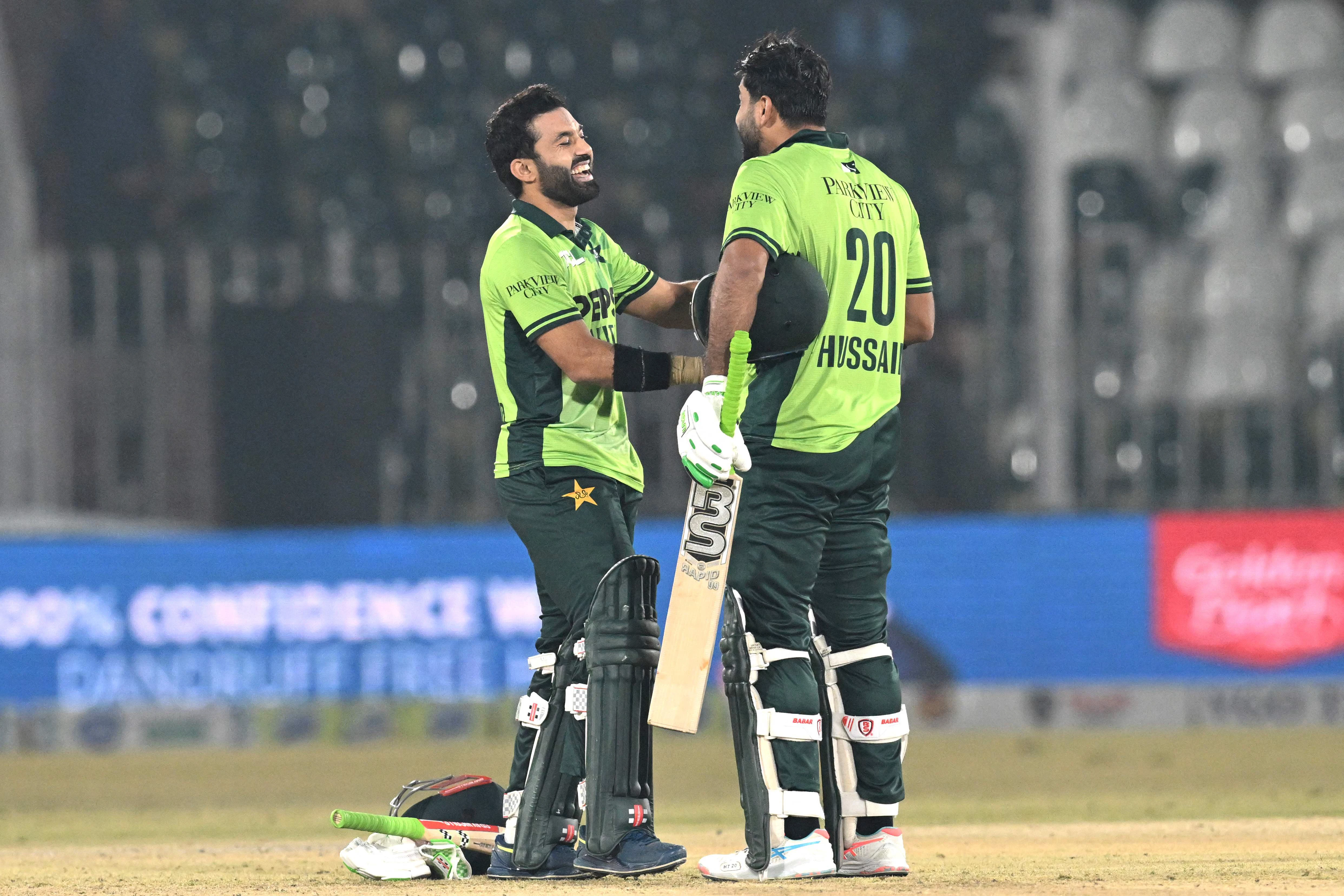 pakistan s mohammad rizwan l and pakistan s hussain talat r celebrate their team s victory at the end of the third one day international odi match against sri lanka at the rawalpindi cricket stadium in rawalpindi on november 16 photo afp