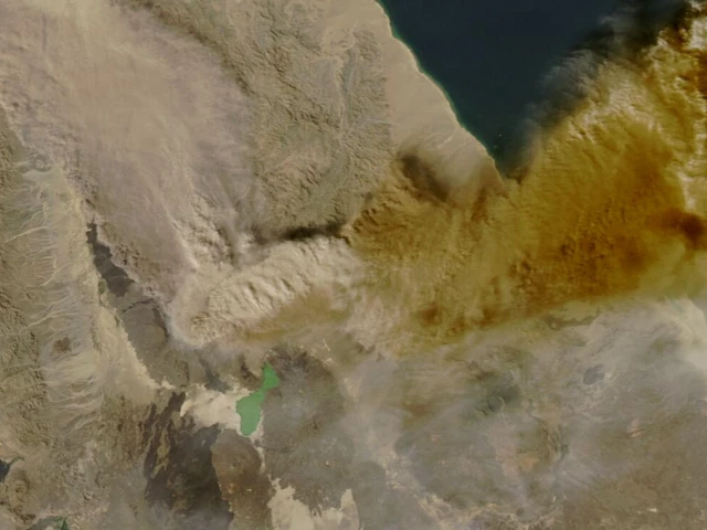 a satellite image shows ash rising from the eruption of the hayli gubbi volcano in ethiopia as it drifts over the red sea photo nasa handout via reuters