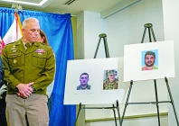 brigadier general leland d blanchard ii looks towards pictures of two national guard members who were shot in washington along with a picture of a suspect afghan national rahmanullah lakanwal at a press conference in washington dc photo reuters