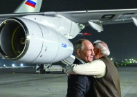 russia s president vladimir putin is welcomed by indian prime minister narendra modi upon his arrival at palam air force base in new delhi photo afp
