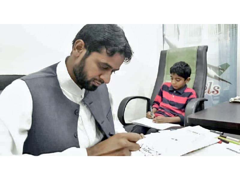 calligrapher obaid raja busy in his work at his studio photo express