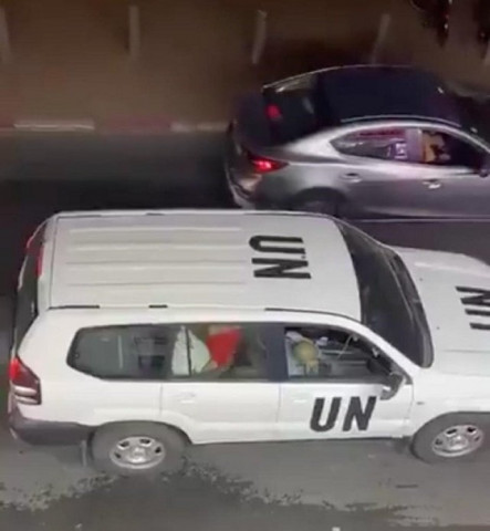 clip shows a woman in a red dress straddling a man in the back seat of a jeep with un markings in israel screengrab twitter clip shows a woman in a red dress straddling a man in the back seat of a jeep with un markings in israel screengrab twitter