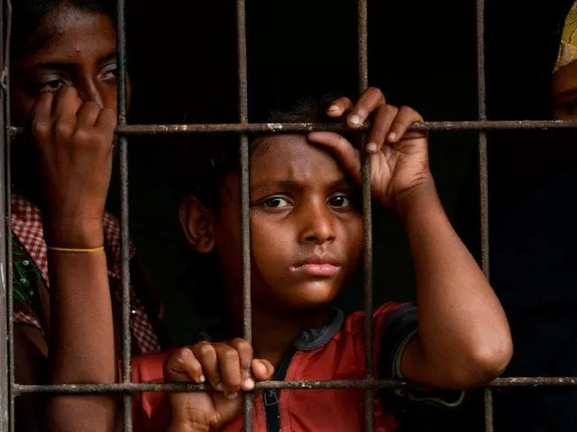 rohingya people from myanmar look through a fence at the immigration detention centre in lhokseumawe in indonesia 039 s north aceh regency photo afp file rohingya people from myanmar look through a fence at the immigration detention centre in lhokseumawe in indonesia 039 s north aceh regency photo afp file