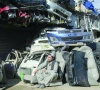 a man sits outside an auto parts shop at a market near the zero point border crossing between afghanistan and pakistan photo afp