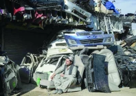 a man sits outside an auto parts shop at a market near the zero point border crossing between afghanistan and pakistan photo afp a man sits outside an auto parts shop at a market near the zero point border crossing between afghanistan and pakistan photo afp