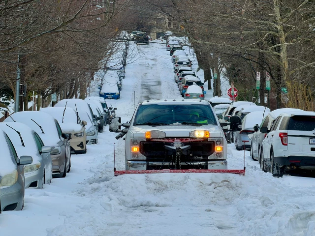 a truck plows snow on a residential street in washongton dc on january 26 2026 photo afp a truck plows snow on a residential street in washongton dc on january 26 2026 photo afp