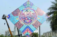 workers install a large kite model to celebrate the basant festival in lahore photo afp