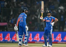 india s ishan kishan celebrates after scoring a half century during the 2026 icc men s t20 cricket world cup group stage match between india and namibia at the arun jaitley stadium in new delhi on february 12 2026 photo afp