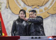 north korean leader kim jong un r and his daughter kim ju ae attending the military parade to commemorate the 9th congress of the workers party of korea at kim il sung square in pyongyang photo afp