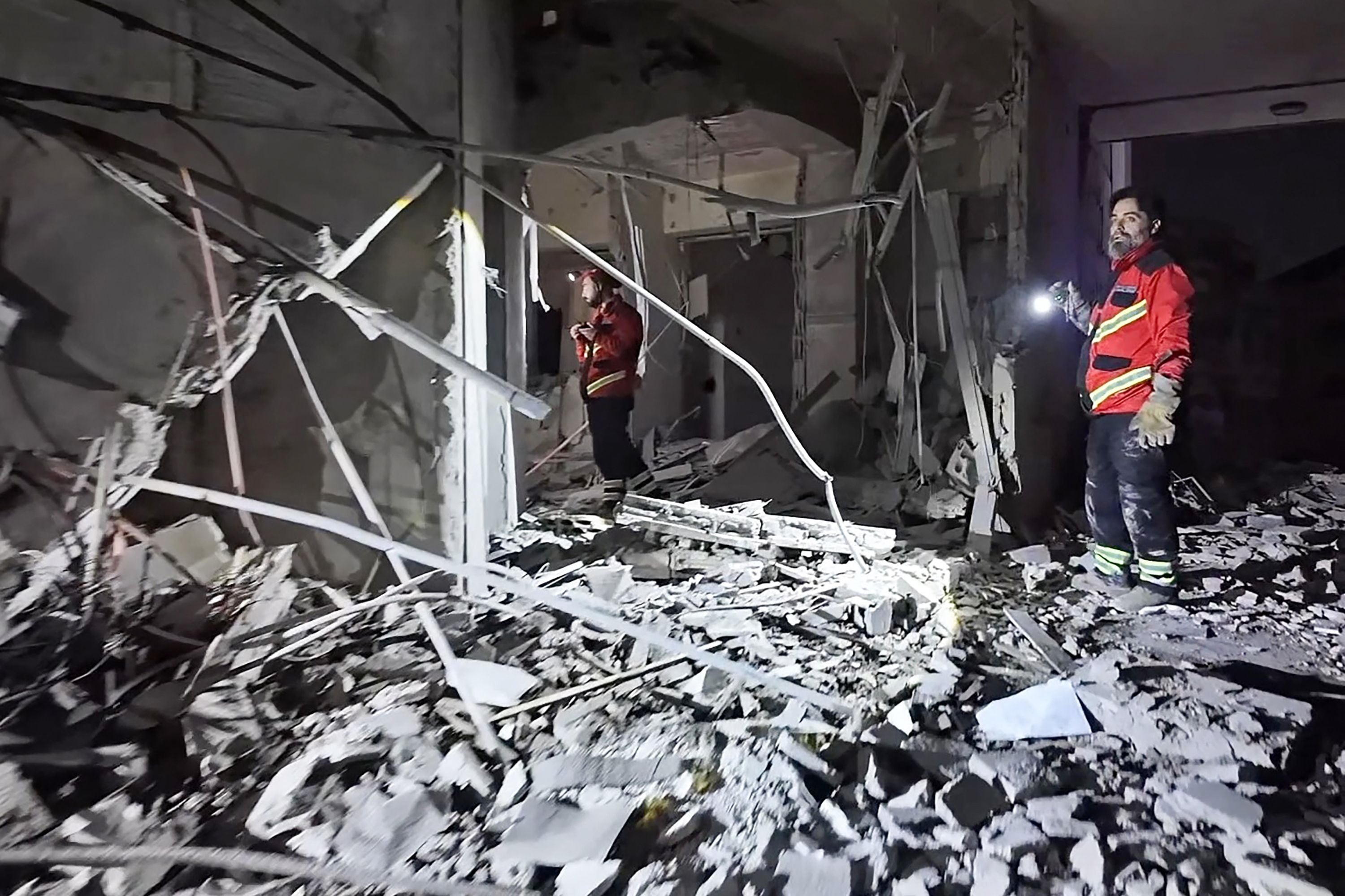 This frame grab from AFPTV video footage taken on March 4, 2026 shows first responders inspecting the damage at Comfort Hotel after it was hit by an Israeli strike in Beirut's eastern suburb of Hazmieh. PHOTO: AFP