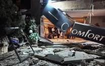 israel launches new strikes as iran squeezes strait of hormuz