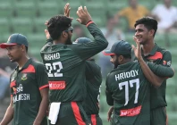 bangladesh s nahid rana celebrates with teammates after taking the wicket of pakistan s salman agha during the first one day international odi cricket match between bangladesh and pakistan at sher e bangla national stadium in mirpur on march 11 2026 photo afp
