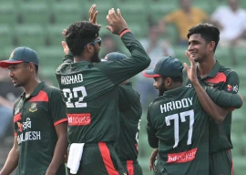 bangladesh s nahid rana celebrates with teammates after taking the wicket of pakistan s salman agha during the first one day international odi cricket match between bangladesh and pakistan at sher e bangla national stadium in mirpur on march 11 2026 photo afp