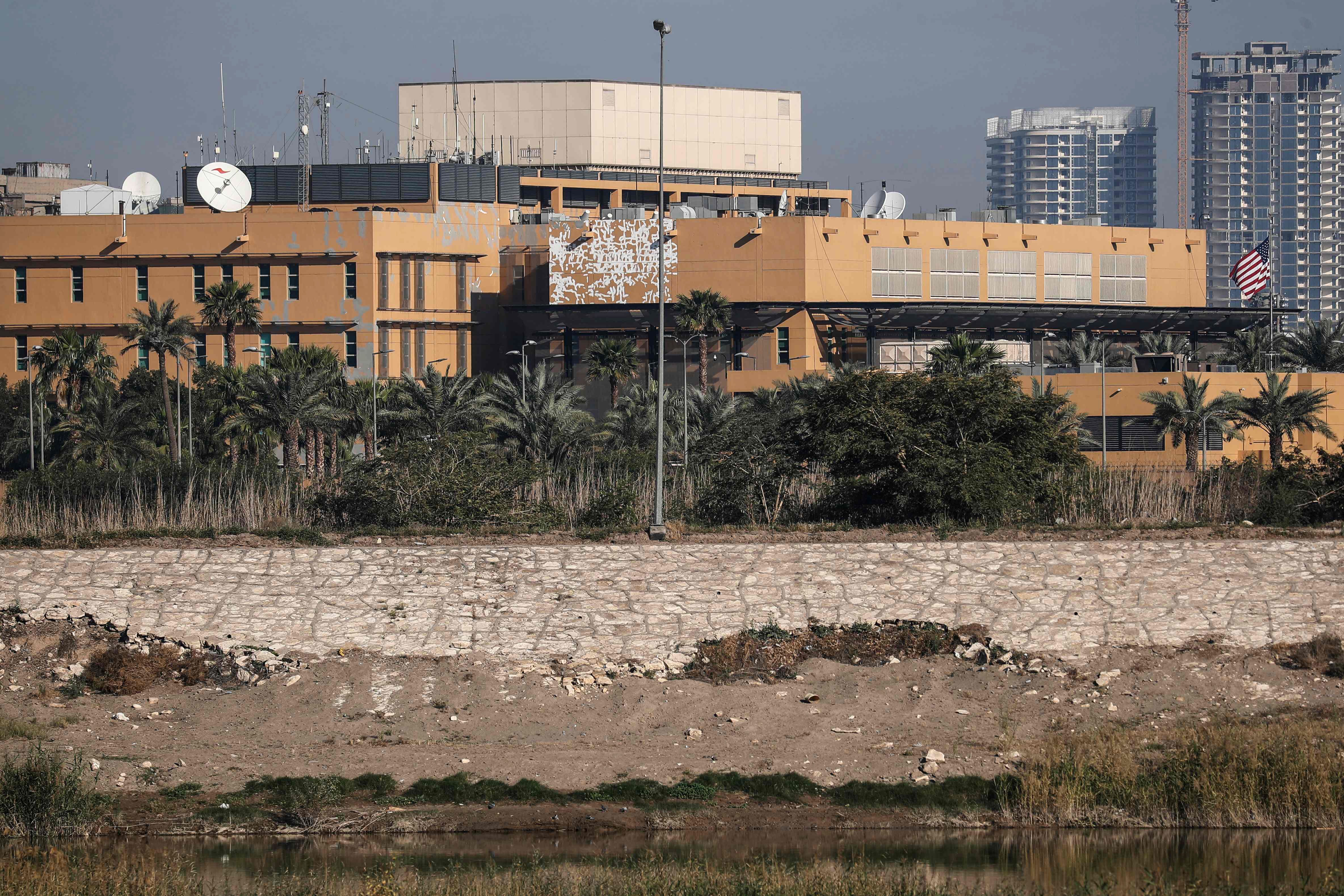 The US flag flutters outside the US Embassy, seen across the Tigris River in Baghdad's fortified Green Zone, in the Iraqi capital on March 17, 2026. A security official said a drone and rocket attack targeted the US embassy in Baghdad early March 17, following a similar attack hours earlier. PHOTO: REUTERS
