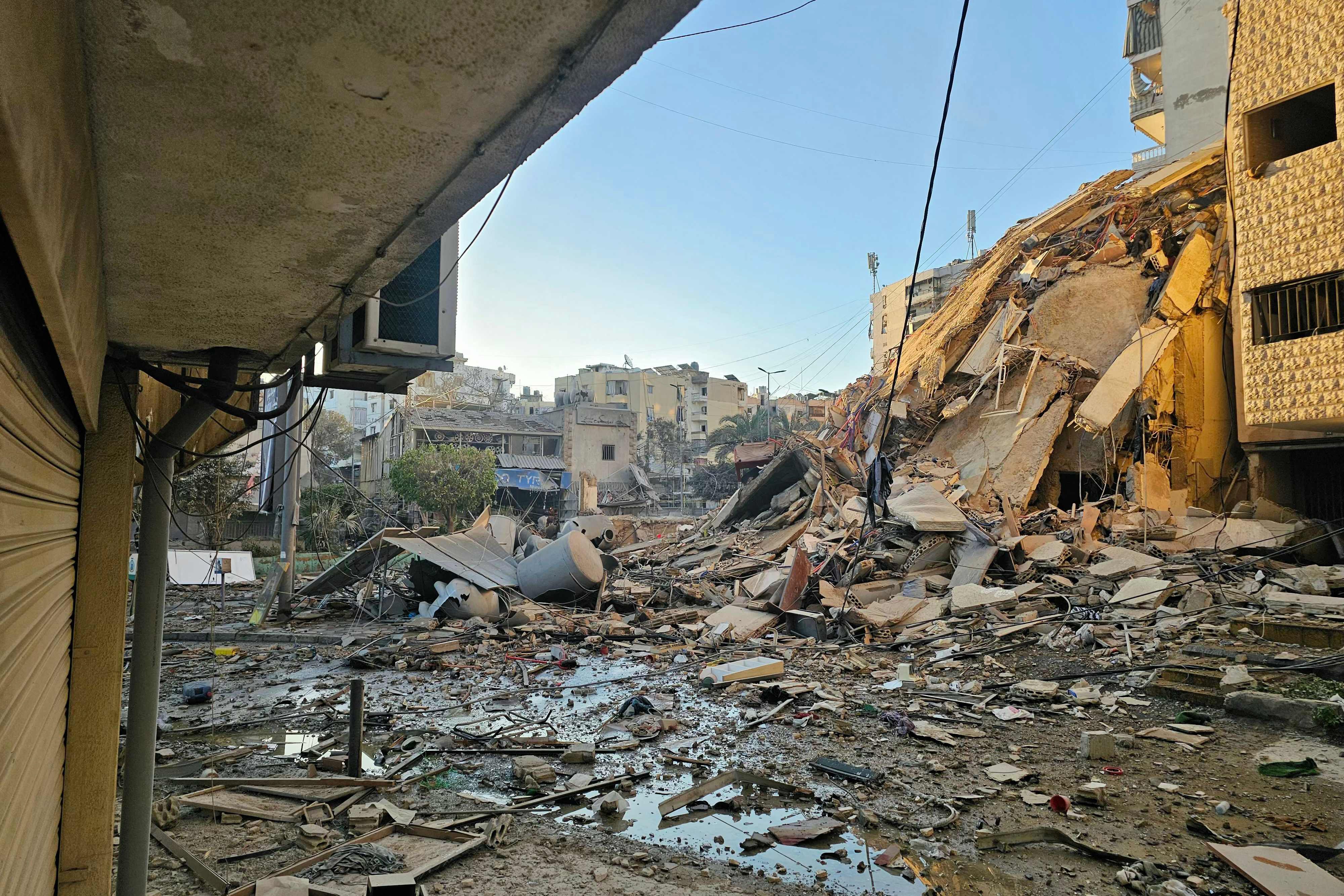 Rubble and debris are strewn across a road at the site of an Israeli airstrike that targeted Beirut s southern suburbs, in the al Kafaat neighborhood, on March 17, 2026. PHOTO: AFP