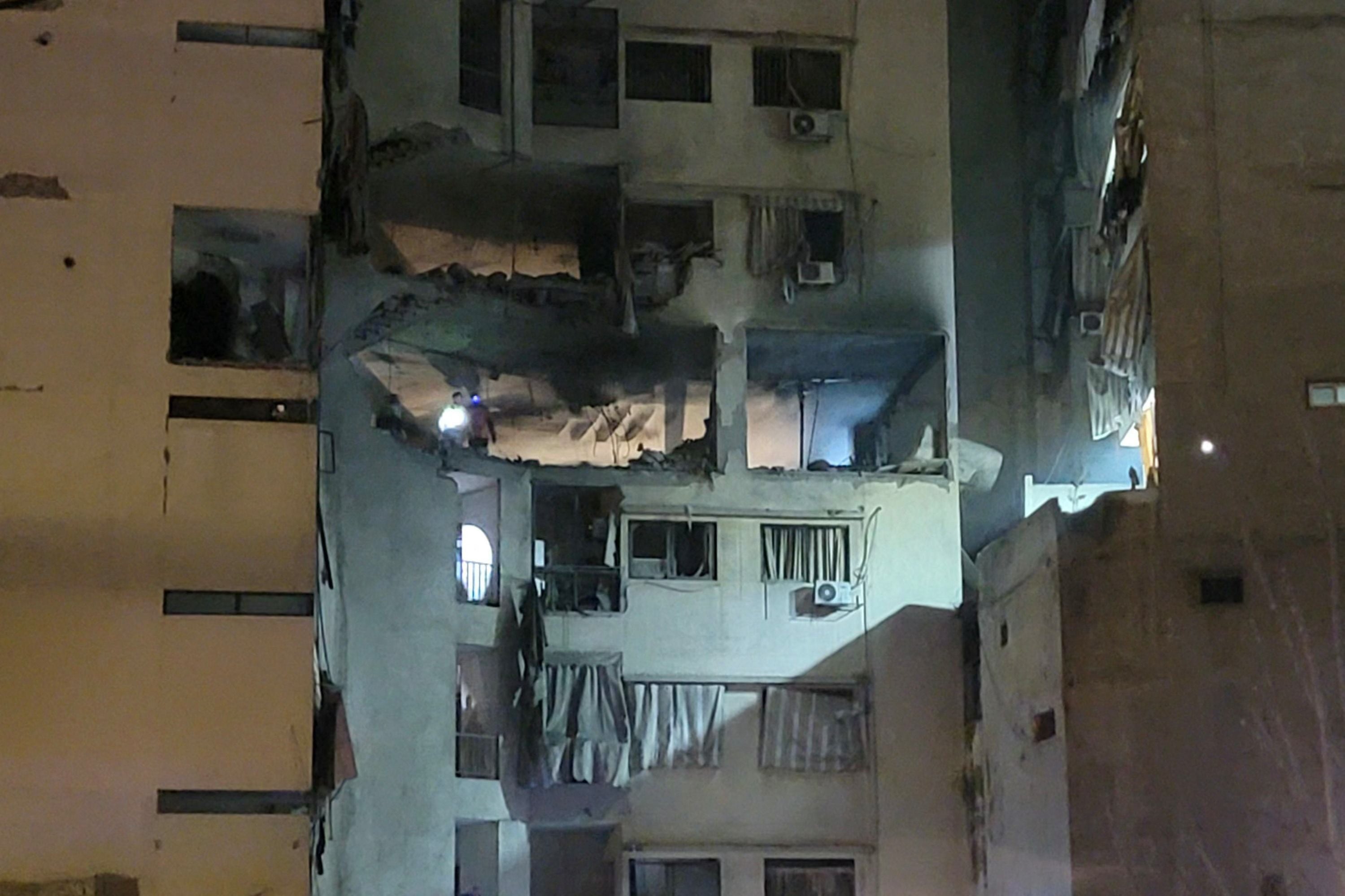 First aid responders inspect the site of an Israeli airstrike that targeted an apartment in the al Basta neighborhood in Beirut, on March 18, 2026. PHOTO: AFP