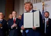 us president donald trump shows a signed executive order related to a new ai powered government website america gov during the website s national design studio launch event at the mellon auditorium in washington dc us september 29 2026 reuters