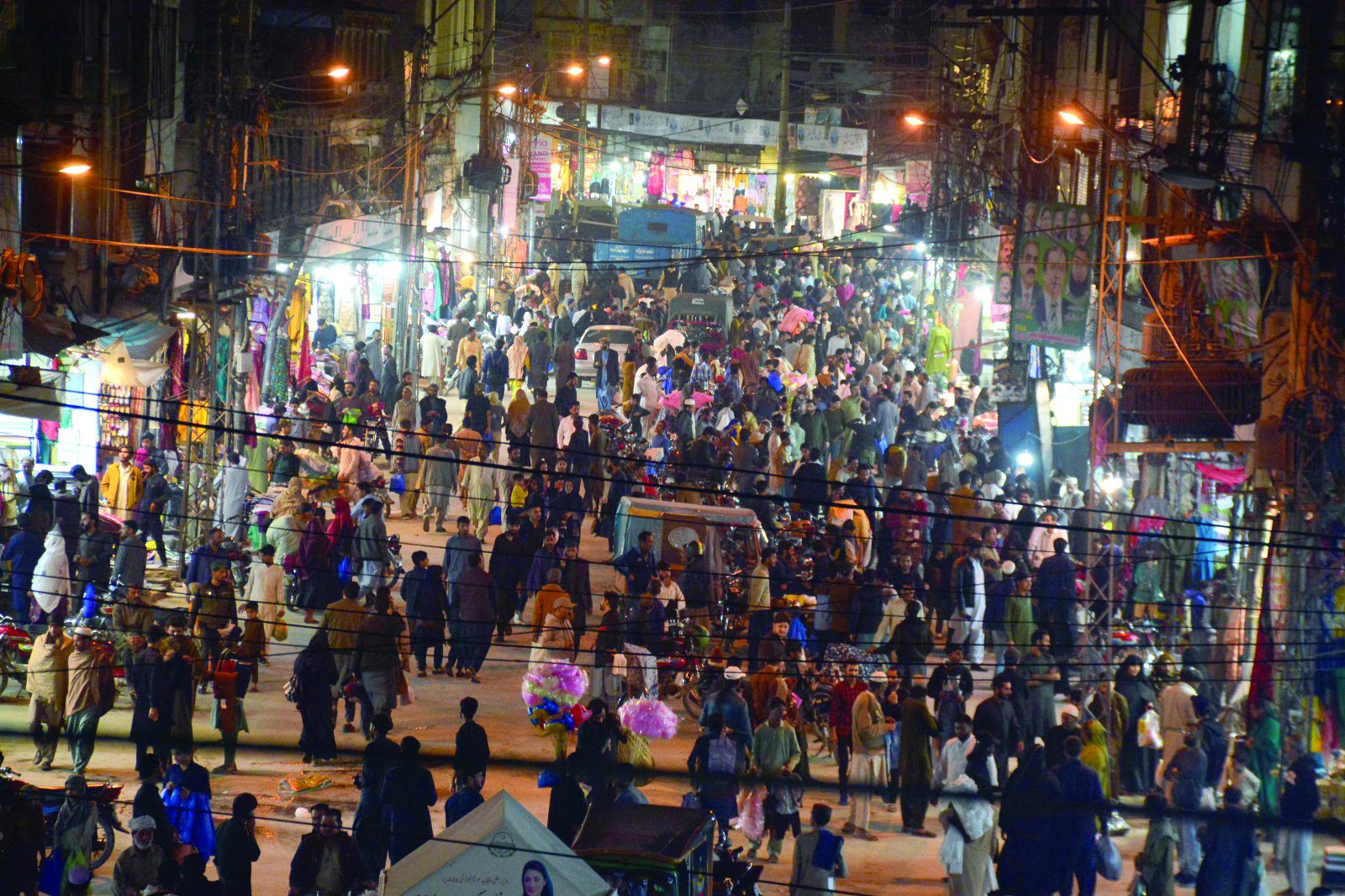 a crowd throngs the bara bazaar in rawalpindi