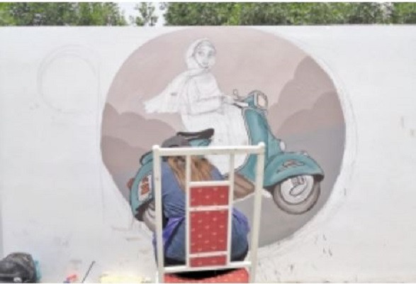 an artist makes a painting on a wall near the national stadium in karachi as part of the rang de karachi drive meant to both beautify the city and convey social awareness messages photo express