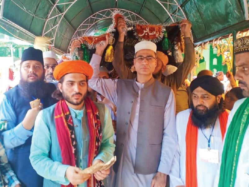 pakistani devotees carry a traditional chador to be placed at the shrine of hazrat khawaja allauddin ali ahmed sabir ra in kaliyar sharif photo express