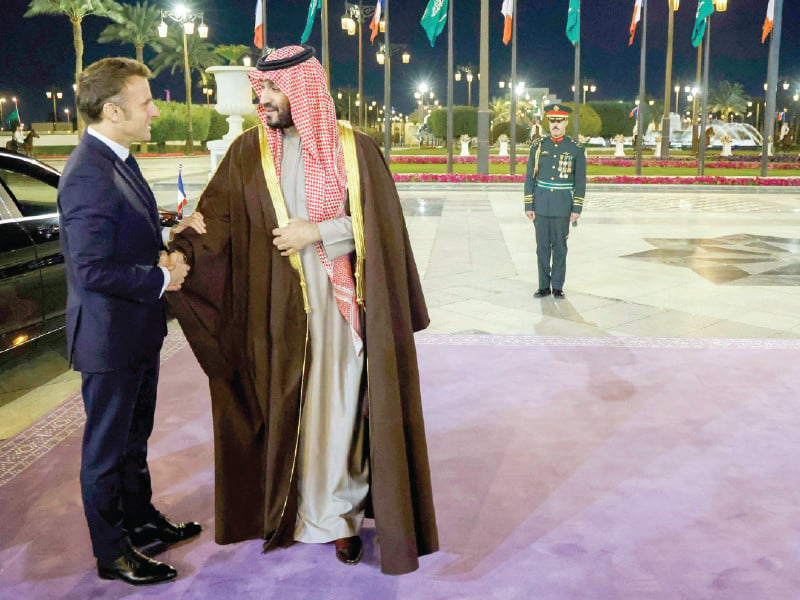 french president emmanuel macron is welcomed by saudi s crown prince mohamed bin salman ahead of their meeting in riyadh photo afp