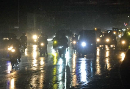 traffic moves slowly along korangi road during light rain as headlights and taillights reflect on the wet asphalt creating a shimmering nighttime scene of cars and motorbikes navigating the slick streets photo jalal qureshi express traffic moves slowly along korangi road during light rain as headlights and taillights reflect on the wet asphalt creating a shimmering nighttime scene of cars and motorbikes navigating the slick streets photo jalal qureshi express
