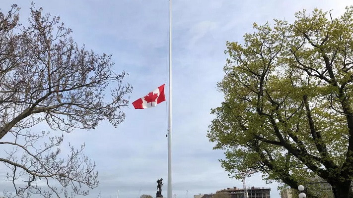 canada s national flag flies at half mast at the british columbia legislature in victoria after the remains of 215 children were discovered in a mass grave at the former kamloops indian residential school site photo reuters