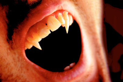 man plays vampire attempts to suck blood