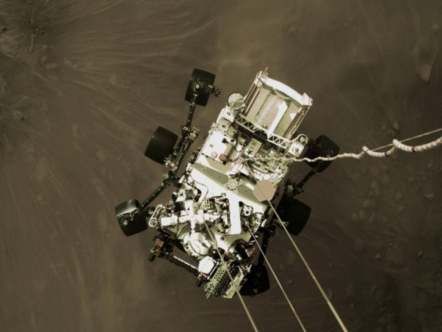 nasa s perseverance rover descends to touch down on mars in a still image from a video camera aboard the descent stage taken february 18 2021 photo nasa nasa s perseverance rover descends to touch down on mars in a still image from a video camera aboard the descent stage taken february 18 2021 photo nasa
