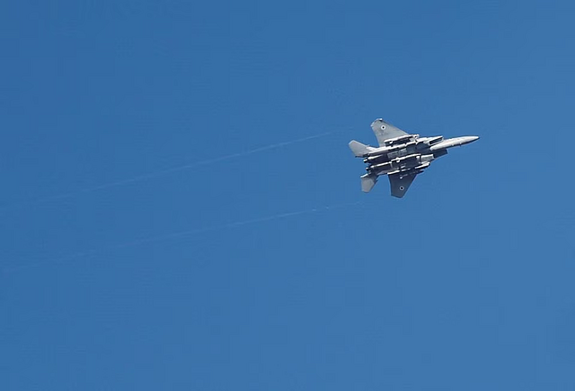 An Israeli war jet is seen as rocket barrages are launched from the Gaza Strip, in Ashdod, Israel October 7: REUTERS