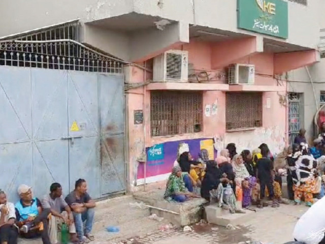 women sit outside the k electric office in mauripur in a protest against power disconnections photo express women sit outside the k electric office in mauripur in a protest against power disconnections photo express