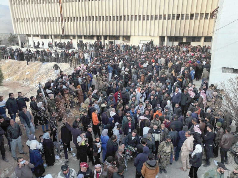 people gather at the sednaya prison in damascus syrian rescuers searched the sednaya jail synonymous with the worst atrocities of ousted president bashar al assad s rule photo afp