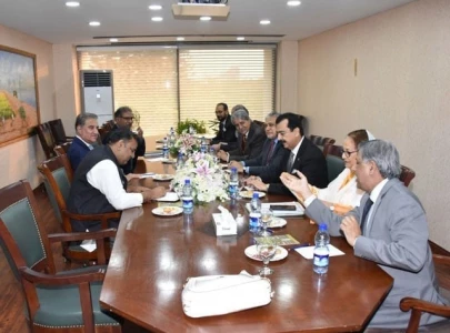 in first bitter foes sit across the table in first bitter foes sit across the table