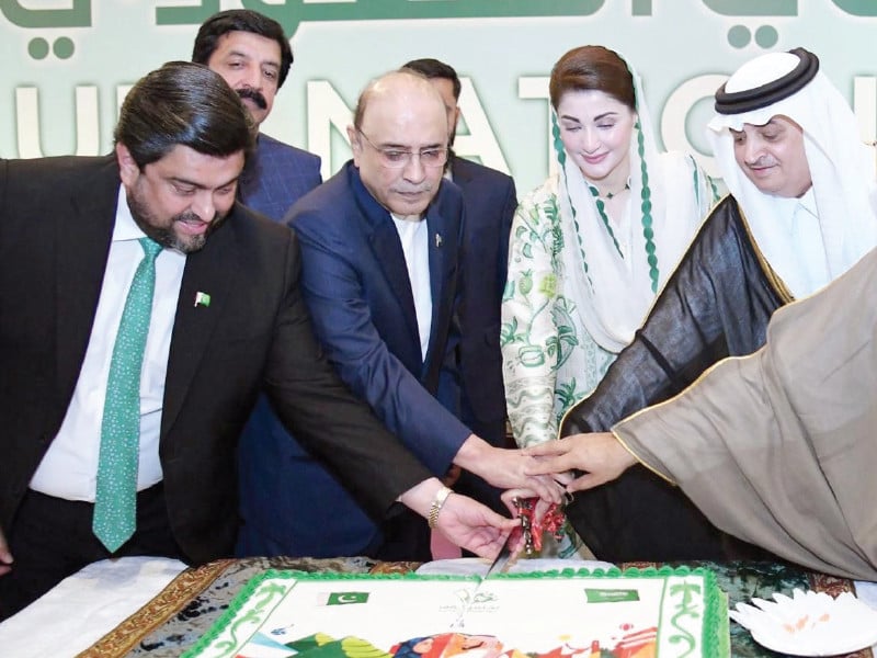 president asif zardari and saudi ambassador nawaf bin saeed ahmed al malkiy cut a cake on the national day of kingdom of saudi arabia in islamabad photo express