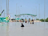 people wade through floodwater on the m 5 motorway in jalalpur where heavy inundation forced the closure of traffic and disrupted movement of vehicles for several hours photo app people wade through floodwater on the m 5 motorway in jalalpur where heavy inundation forced the closure of traffic and disrupted movement of vehicles for several hours photo app