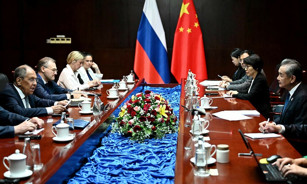 china s foreign minister wang yi and russia s foreign minister sergei lavrov hold a meeting on the sidelines of the 57th association of southeast asian nations asean in vientiane on july 25 2024 photo afp