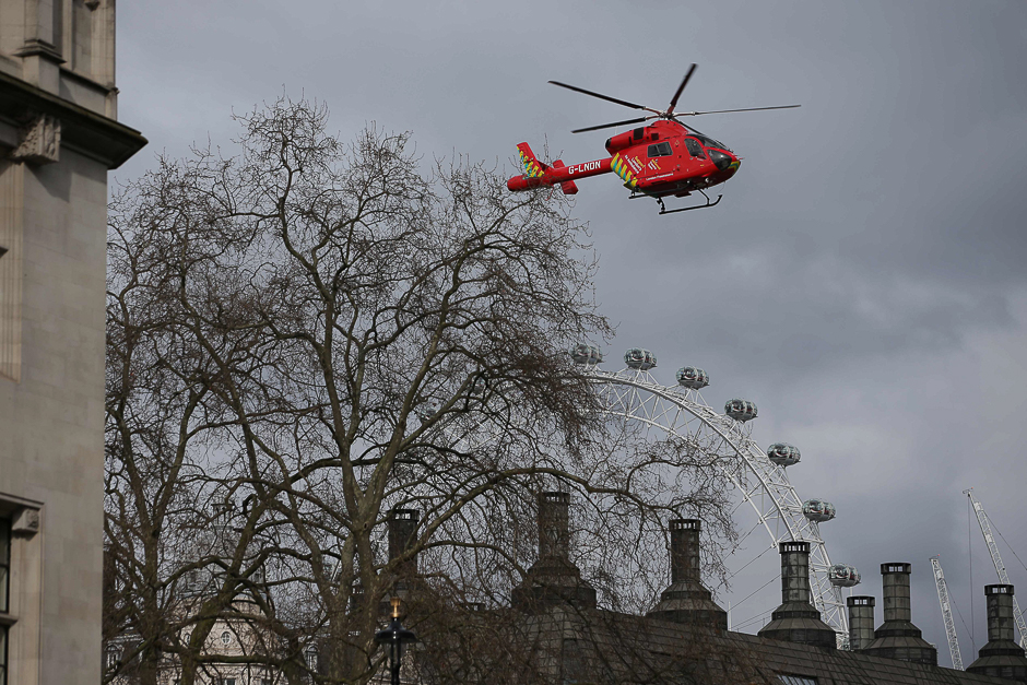 An air ambulance flies above Portcullis House, next to the Houses of Parliament in central London. PHOTO: AFP