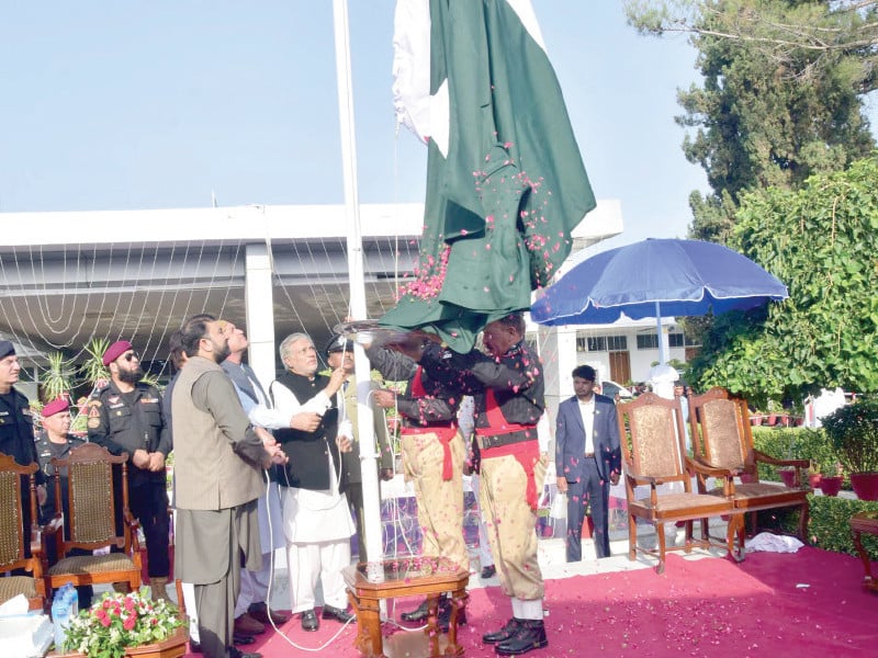 deputy prime minister and foreign minister ishaq dar hoists the national flag to mark the 77th independence day of pakistan in quetta photo ppi