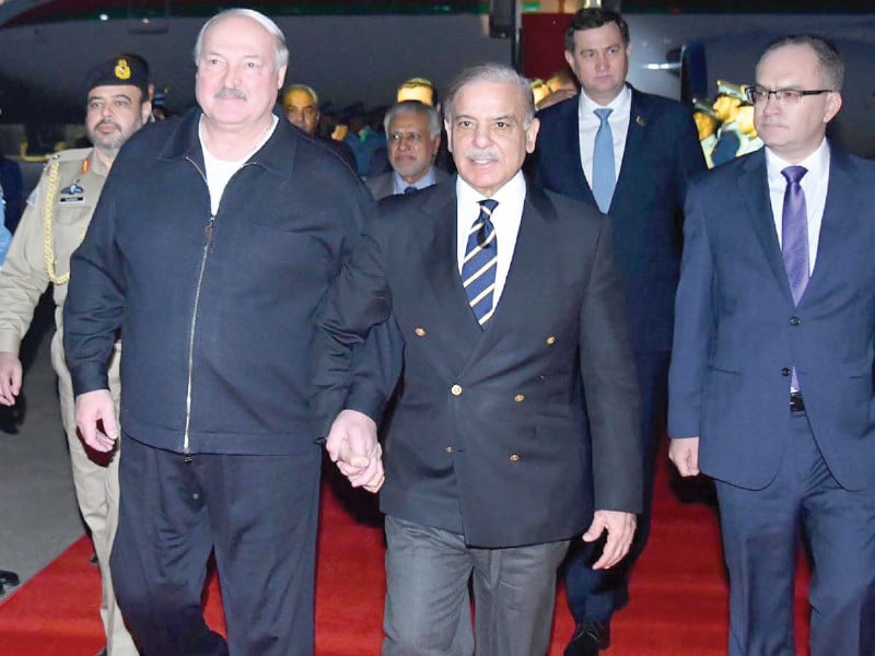 prime minister shehbaz sharif walks with belarus president aleksandr lukashenko after receiving him upon his arrival at the paf nur khan air base photo sabah