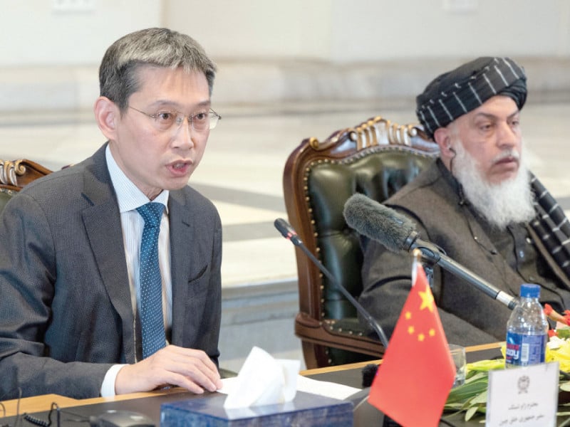 china s ambassador to afghanistan zhao xing along with afghanistan s deputy foreign minister for political affairs sher mohammad abbas stanekzai speaks during a meeting to celebrate the 70th anniversary of establishment of diplomatic relations between the two countries at the foreign ministry in kabul photo afp