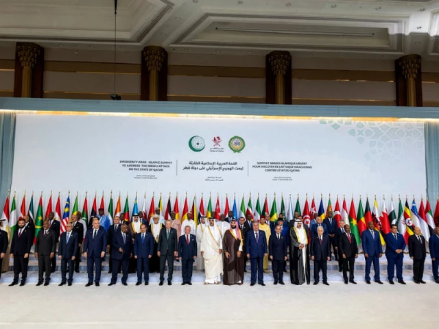 leaders heads of state and other officials pose for a group photo during the 2025 arab islamic emergency summit in doha photo afp