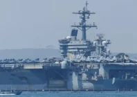 us deploys aircraft carrier as iran warns against attack