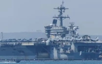 us deploys aircraft carrier as iran warns against attack