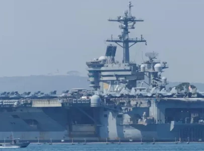 us deploys aircraft carrier as iran warns against attack