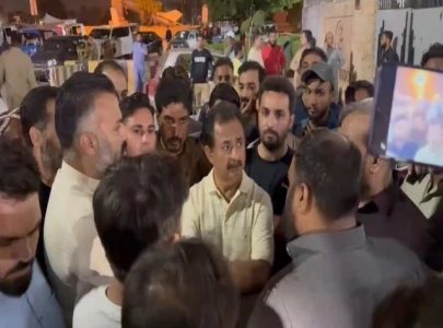 two pti members shot during armed robbery attempt in karachi