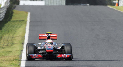 f1 vettel crashes as button tops practice