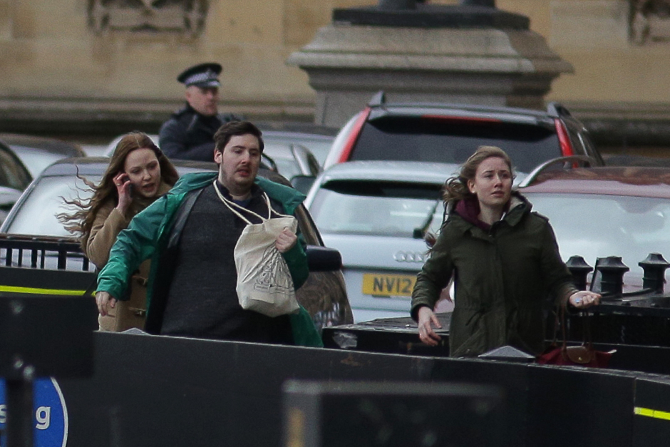 People leave after being evacuated from the Houses of Parliament in central London. PHOTO: REUTERS