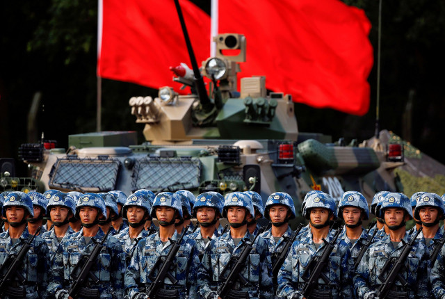 chinese troops prepare for the arrival of president xi jinping at the pla hong kong garrison during a 2017 event marking the 20th anniversary of the city s handover from british rule reuters