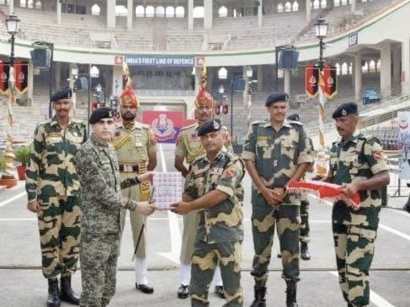 personnel of punjab rangers and bsf exchange pleasantries at the wagah border photo express